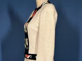 an image of a woman ' s jacket on a mannequin stand