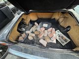 a trunk of a car with a bunch of rocks in it