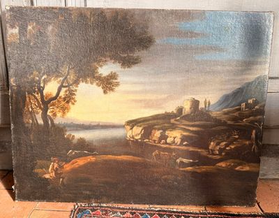 un tableau posé à même le sol d'une pièce recouverte d'un tapis