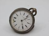 a silver pocket watch with roman numerals on the face