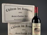 a bottle of wine sitting next to a box of wine