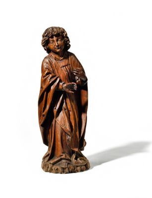 an old wooden statue of a man with a hat and robe