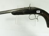 a close up of a gun mounted on a wall