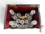 a wooden box with a bunch of empty wine glasses inside of it