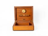 an image of a wooden box with a clock inside of it