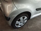 a car that has been dented and is parked in a garage
