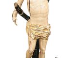 une statue représentant un homme tenant une guitare et un tambour