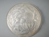an image of a glass plate with a flower design on it