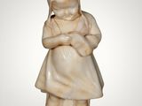 marble figurine of a girl holding a baby in her arms