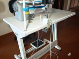 a sewing machine that is sitting on a table