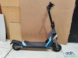a scooter that is sitting on the sidewalk
