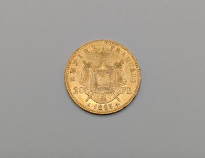 l'image d'une pièce d'or sur une surface grise
