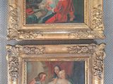 deux tableaux encadrés représentant une femme et un homme en robe rouge