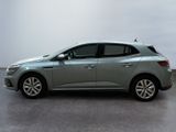 the grey car is parked in a large room with a white wall