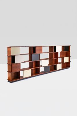 an image of a bookcase with multiple shelves on it