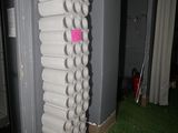 a stack of cups on the floor next to a door