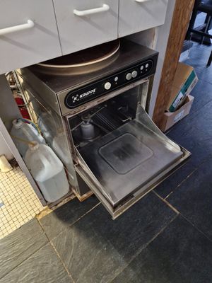 an open oven in the middle of a kitchen