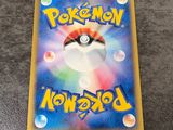 a close up of a pokemon card on a table