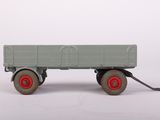 a toy truck that is sitting on a white surface