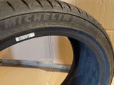 a close up of a tire that is on a wooden floor