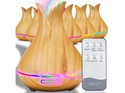 a wooden diffuser with a remote control in front of it