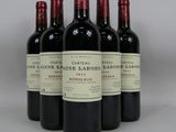 six bottles of red wine are lined up in a row