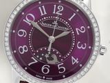a close up of a purple watch with diamonds on it