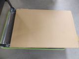 a table that has a piece of cardboard on it