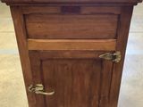 an old wooden cabinet with a sink on top of it