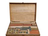 a wooden box with a game in it on a white background