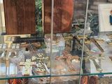 a glass display case with a variety of religious items