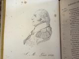 an open book with a drawing of a man on it