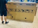 a man that is standing next to a large box