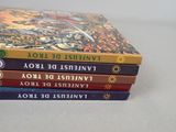 several books stacked on top of each other on a table