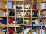 a wooden shelf with many different types of items on it