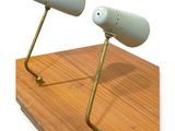 two lamps that are on top of a wooden table