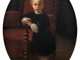 portrait of a young boy in a black dress sitting in a red chair