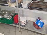 a metal shelf that has various items on it