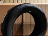 a tire that is sitting on the floor in front of a box