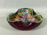 a glass bowl with a colorful design on it