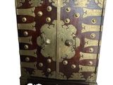 an image of a wooden cabinet with a gold and red design on it
