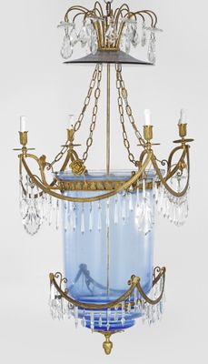 an image of a chandelier with a blue glass bowl hanging from it ' s ceiling