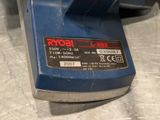 a close up of a blue machine with a label on it