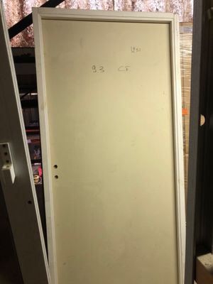 a white door with writing on it in a room