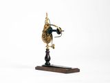 a clock that is on a stand on a white background