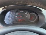 dashboard of a car with a speedometer and steering wheel