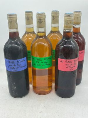 six bouteilles de vin sont alignées sur une surface blanche