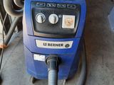 a blue machine that is sitting in the garage