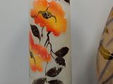 two vases that have been painted with flowers on them