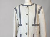 an image of a white and gray jacket on a mannequin